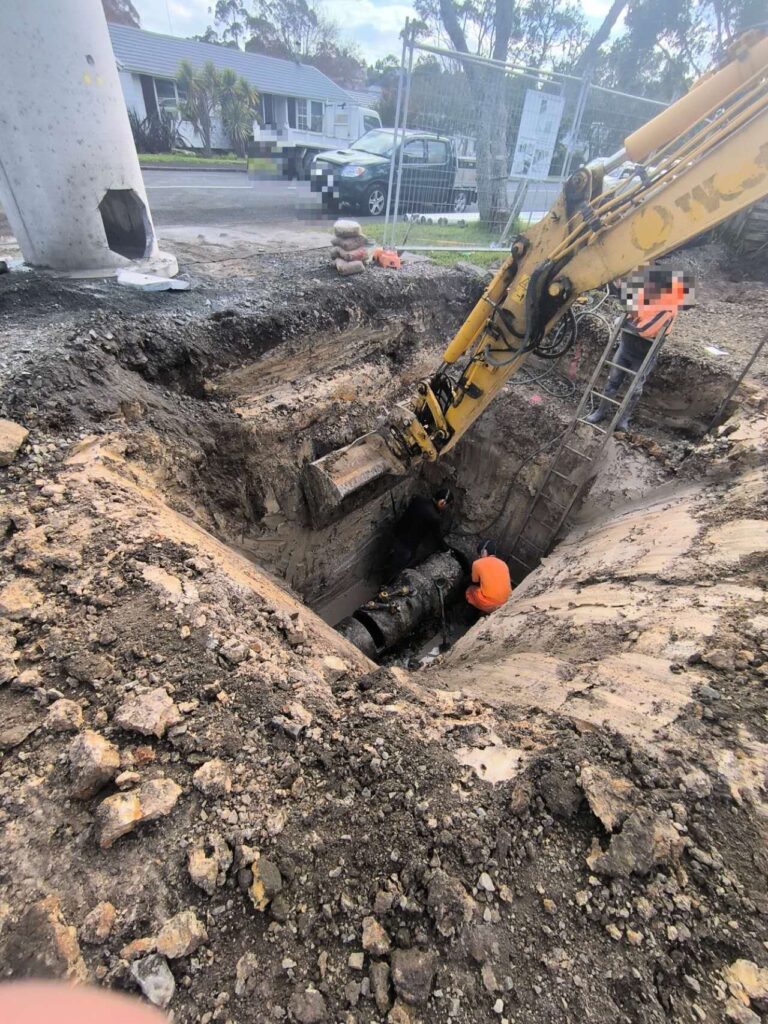 Excavated public drainage trench in a road