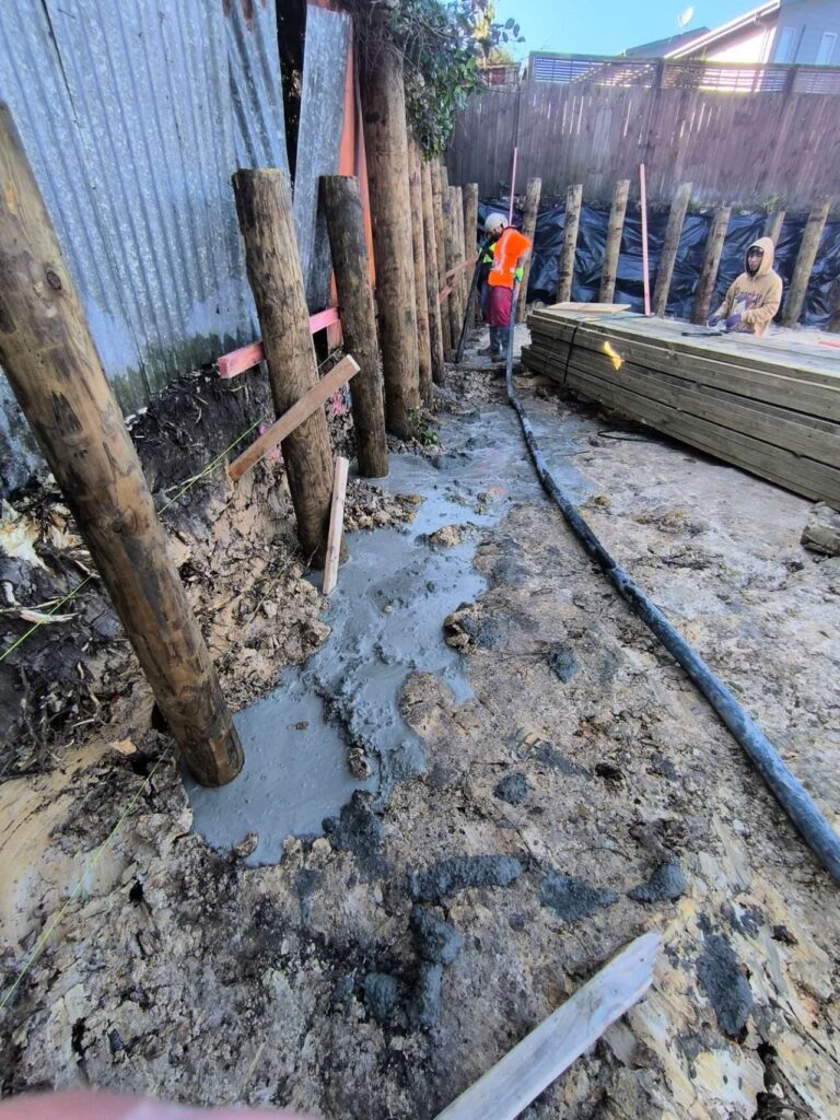 Timber pole retaining wall