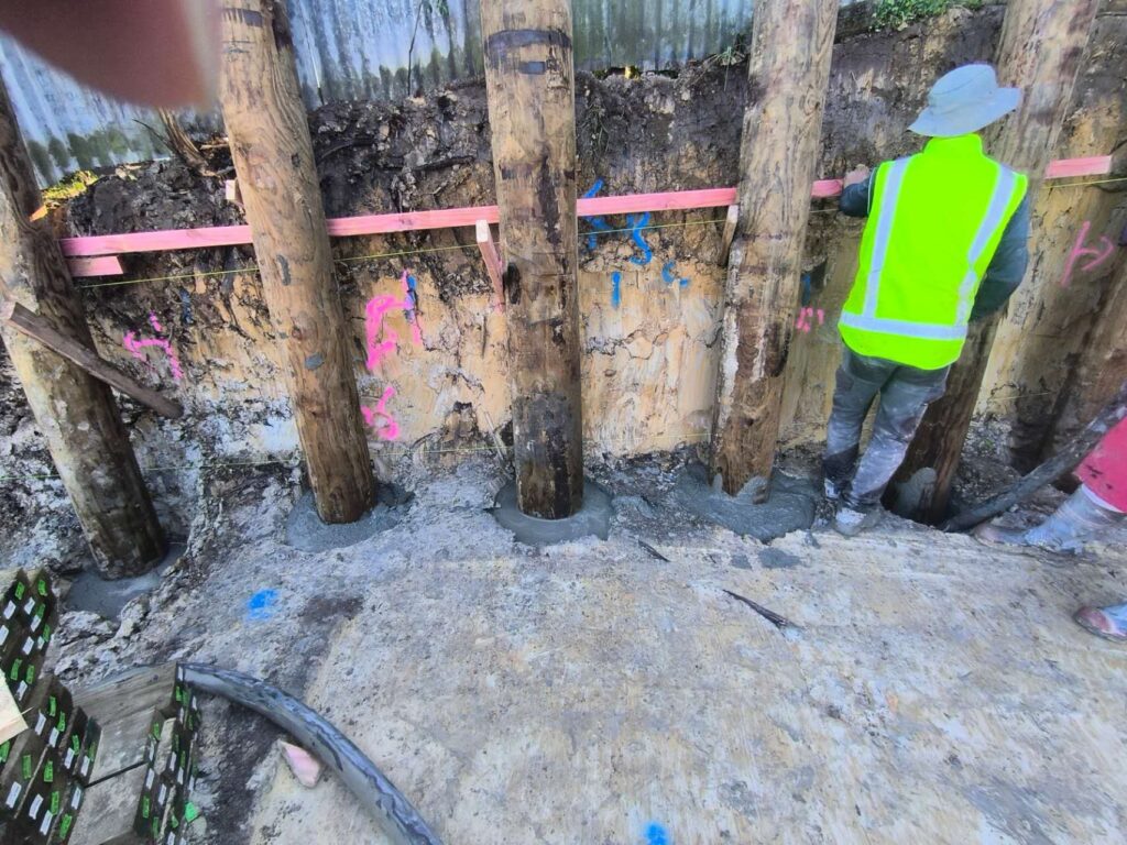 Retaining wall pole installation